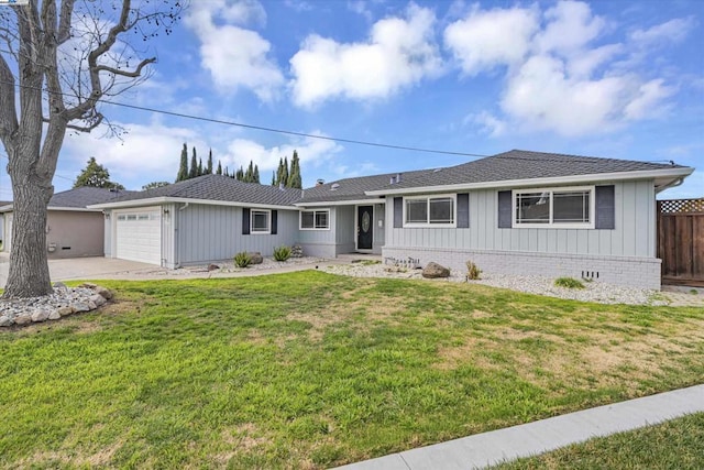 ranch-style home featuring a garage and a front lawn