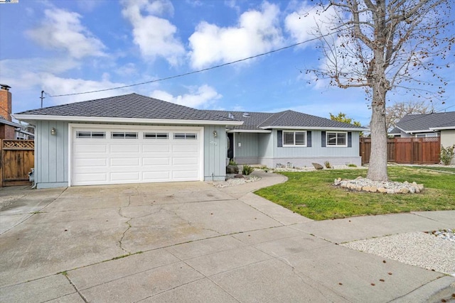 single story home featuring a garage and a front yard