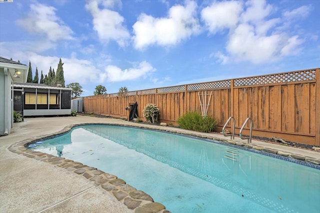 view of swimming pool featuring a patio