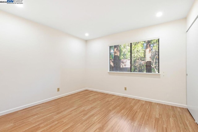 empty room with light wood-type flooring