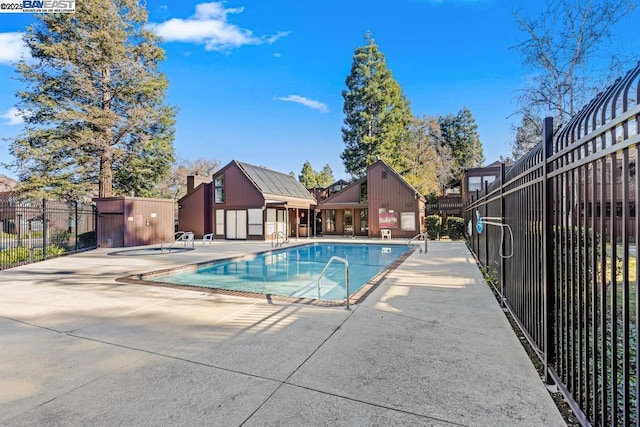 view of pool featuring a patio