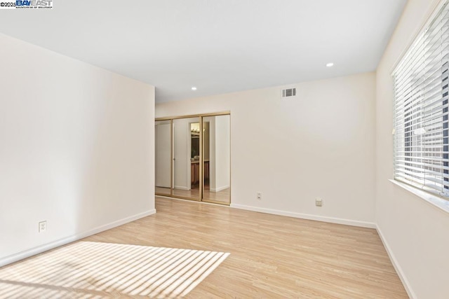 unfurnished room featuring light hardwood / wood-style flooring