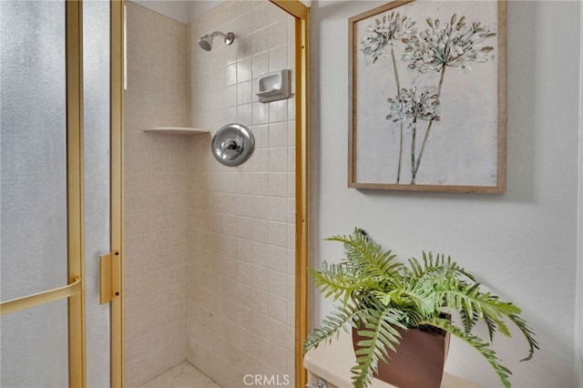 bathroom with tiled shower