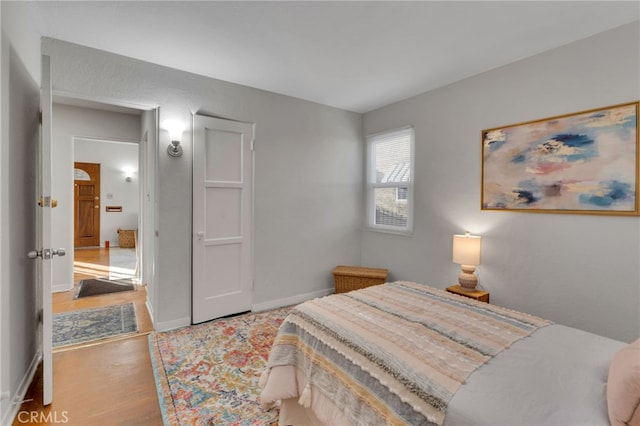 bedroom with wood-type flooring