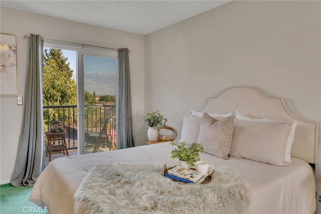 carpeted bedroom with access to exterior