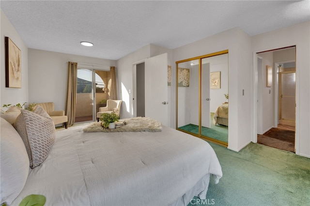 carpeted bedroom with a textured ceiling