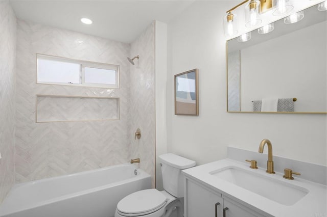 full bathroom with vanity, toilet, and tiled shower / bath