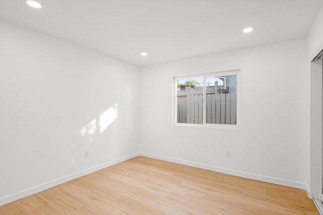 unfurnished room featuring light hardwood / wood-style flooring