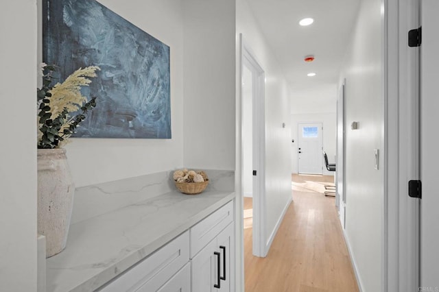 hall with light hardwood / wood-style flooring