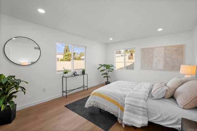 bedroom with light hardwood / wood-style flooring