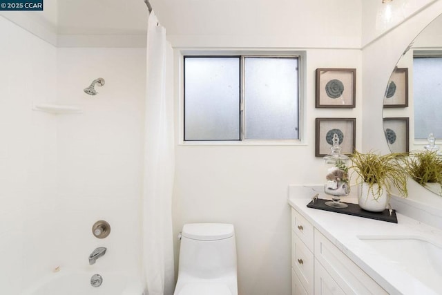 full bathroom with vanity, toilet, and shower / bath combo with shower curtain