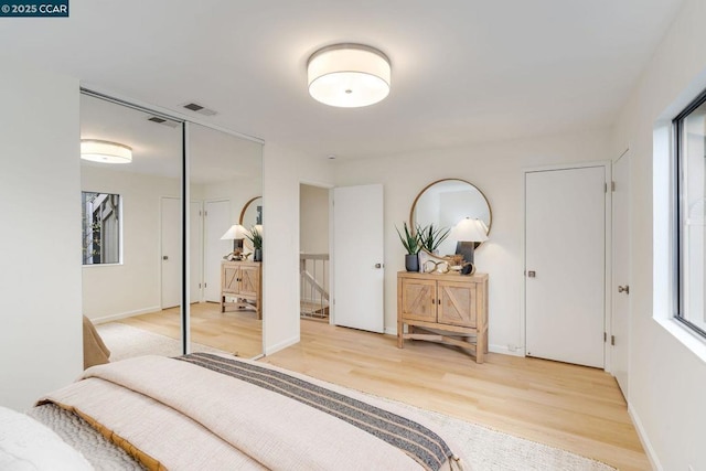 bedroom featuring hardwood / wood-style flooring and a closet