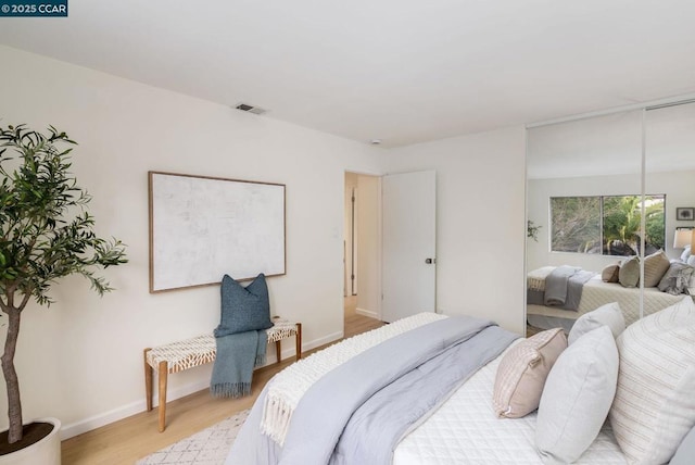 bedroom featuring light hardwood / wood-style flooring