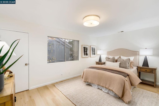 bedroom featuring hardwood / wood-style floors