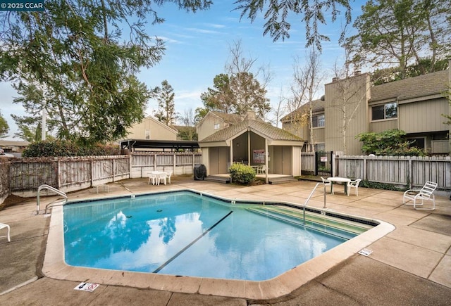 view of swimming pool featuring a patio area