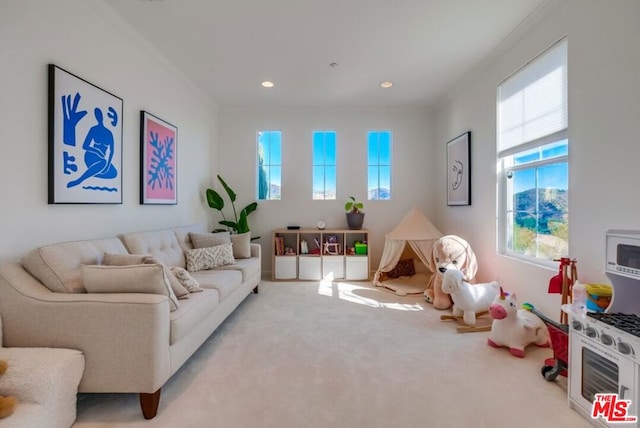 living room featuring crown molding and light carpet