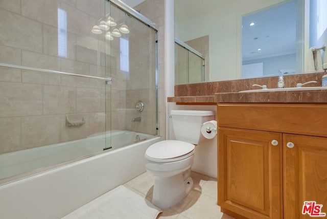 full bathroom featuring tile patterned flooring, vanity, shower / bath combination with glass door, and toilet