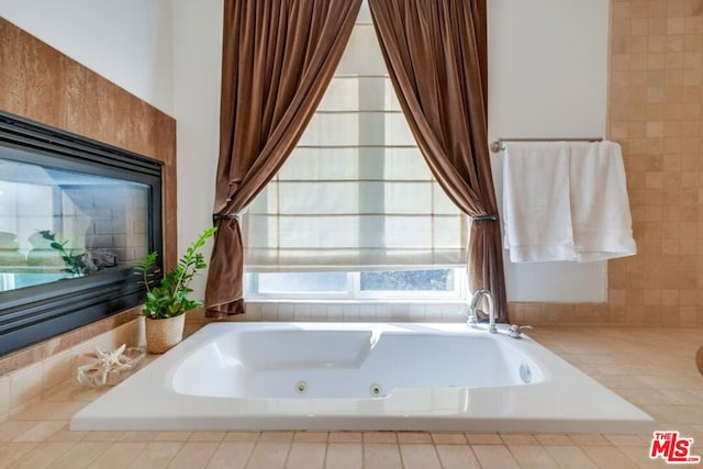 bathroom featuring a relaxing tiled tub