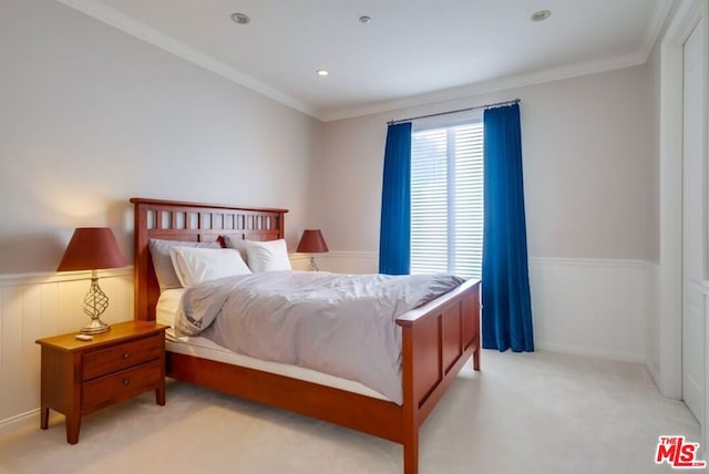 bedroom featuring crown molding and light colored carpet