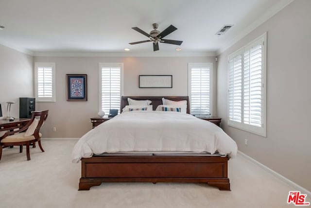 carpeted bedroom with multiple windows, ornamental molding, and ceiling fan