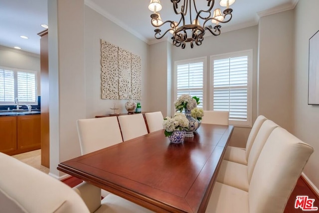 dining space featuring crown molding, sink, and a wealth of natural light