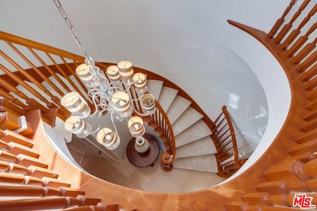 staircase featuring tile patterned flooring