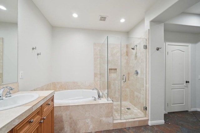 bathroom featuring independent shower and bath and vanity