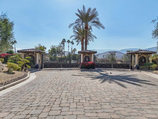 view of gate with a mountain view