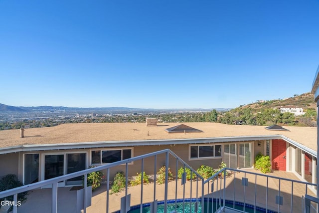 balcony featuring a mountain view