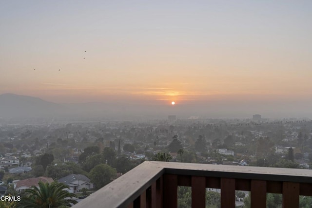 view of balcony at dusk