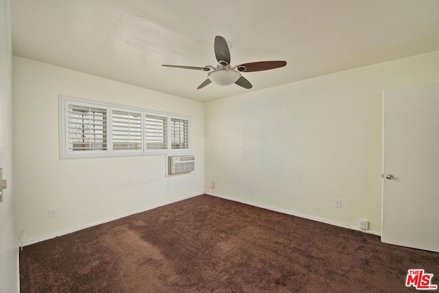 spare room with ceiling fan, a wall mounted air conditioner, and dark colored carpet