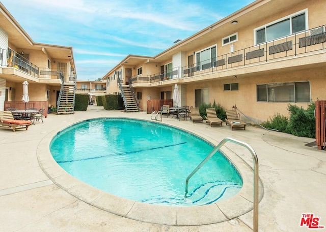 view of pool featuring a patio