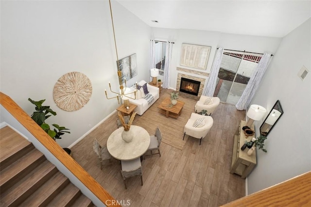 living room with hardwood / wood-style floors and a fireplace