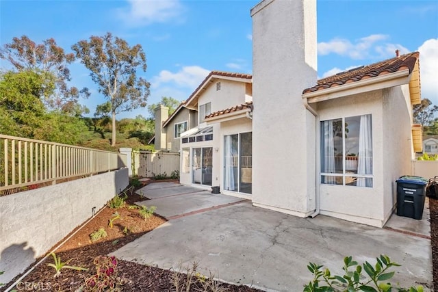 back of house with a patio area