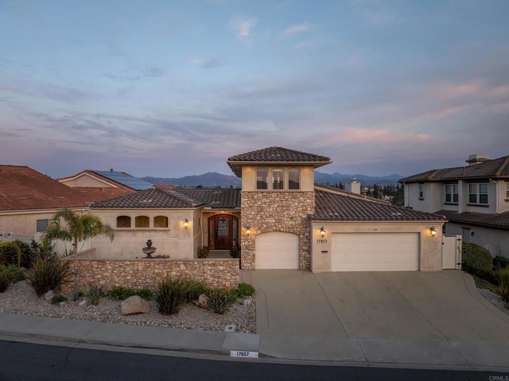 mediterranean / spanish home featuring a mountain view