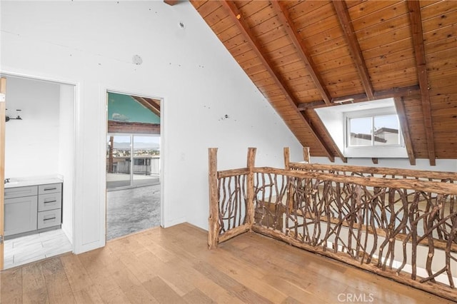 bonus room with wood ceiling, light hardwood / wood-style flooring, and lofted ceiling with beams