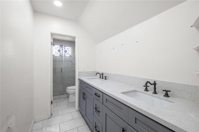 bathroom featuring tile patterned flooring, vanity, an enclosed shower, vaulted ceiling, and toilet