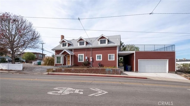 cape cod-style house with a carport