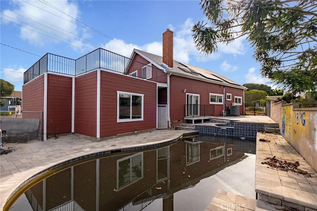 back of property featuring a patio