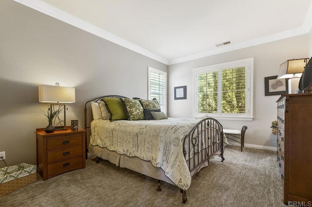 bedroom featuring baseboards, visible vents, ornamental molding, and carpet flooring