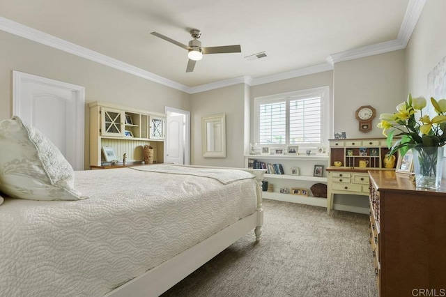 bedroom with carpet floors, visible vents, and crown molding