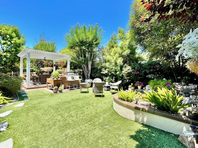 view of yard with an outdoor living space and a pergola