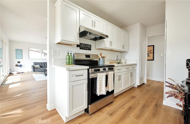 kitchen with white cabinetry, stainless steel range with electric cooktop, and light hardwood / wood-style flooring