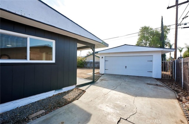 view of home's exterior featuring an outbuilding and a garage