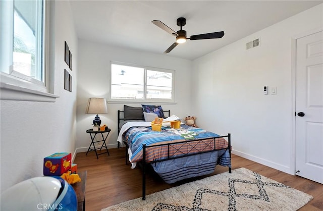 bedroom featuring hardwood / wood-style floors and ceiling fan