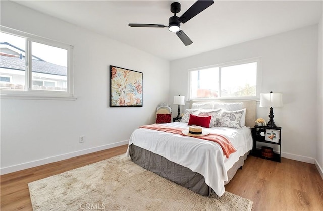 bedroom featuring ceiling fan and light wood-type flooring