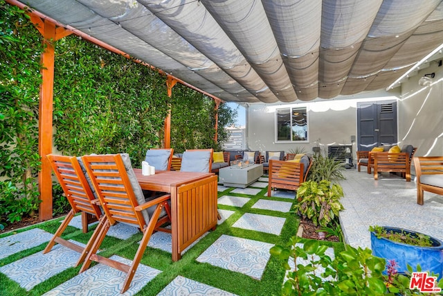 view of patio featuring outdoor lounge area and a pergola