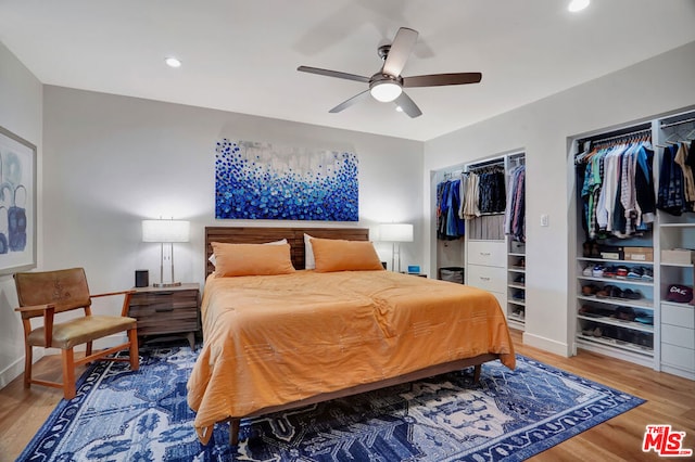 bedroom with hardwood / wood-style flooring and ceiling fan