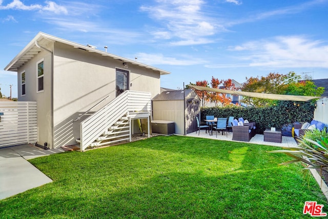 back of property featuring a patio, outdoor lounge area, a shed, and a lawn