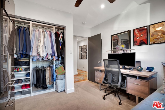 carpeted home office with ceiling fan